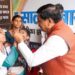 मुख्यमंत्री मोहन यादव बैतूल में पोलियो अभियान का उद्घाटन करते हुए और योग करते हुए