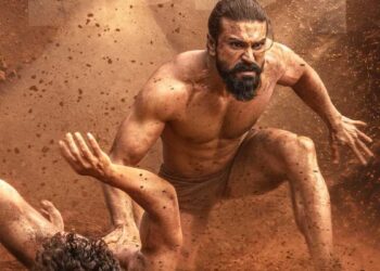 फिल्म 'पेड्डी' के एक दमदार सीन में एथलीट के रूप में नजर आ रहे सुपरस्टार रामचरण का पोस्टर।